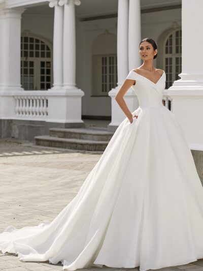Ballgown organza wedding dress with wraparound neckline and drop sleeves, by Pronovias Bridal Shop North Yorkshire