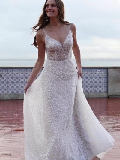 Sparkly sun-kissed beaded A-line wedding dress with a plunging V-back and side cutouts Bridal Shop Northallerton