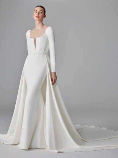 Mermaid wedding dress with V neck with long sleeves in crepe and detachable skirt, by Pronovias. Bridal Shop North Yorkshire