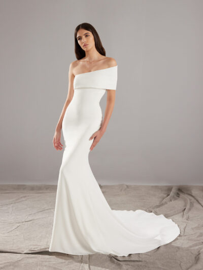 Mermaid wedding dress with asymmetrical back in crepe and detachable sleeves, by Pronovias Bridal Shop North Yorkshire