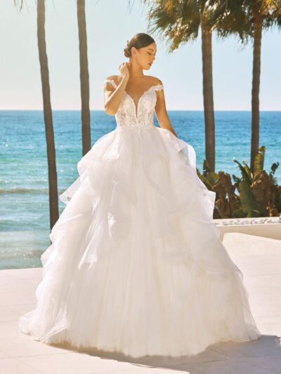 Unique ballgown with organza ruffles, beaded corset bodice and off the shoulder sleeves by Pronovias Off the Peg Bridal Shop North Yorkshire