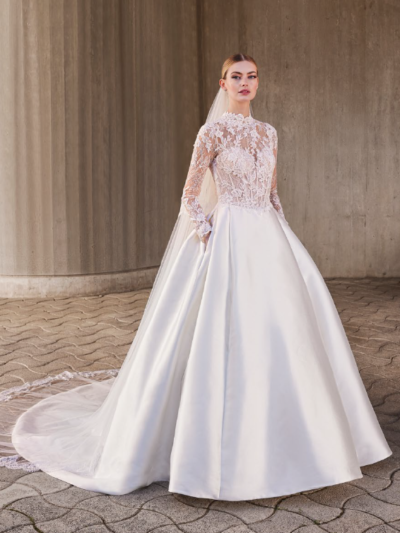 Mikado and lace princess wedding dress with high neck and long sleeves, by Pronovias Bridal Shop Northallerton