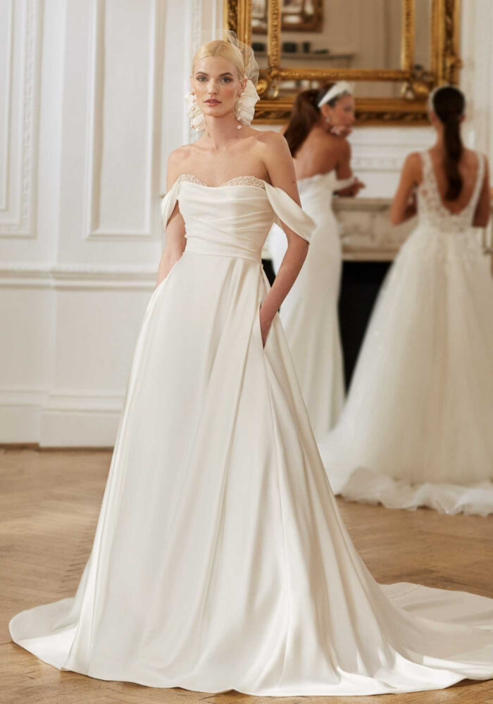 Satin ballgown with pleated bodice and peekaboo beaded cups and detachable straps Bridal Shop Northallerton