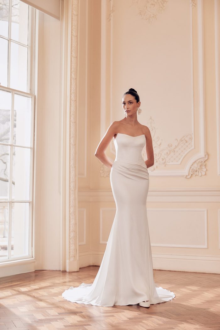 Corset bodice fit and flare wedding dress with ruched detail and cat eye neckline, by Ellis.  Bridal Shop Northallerton