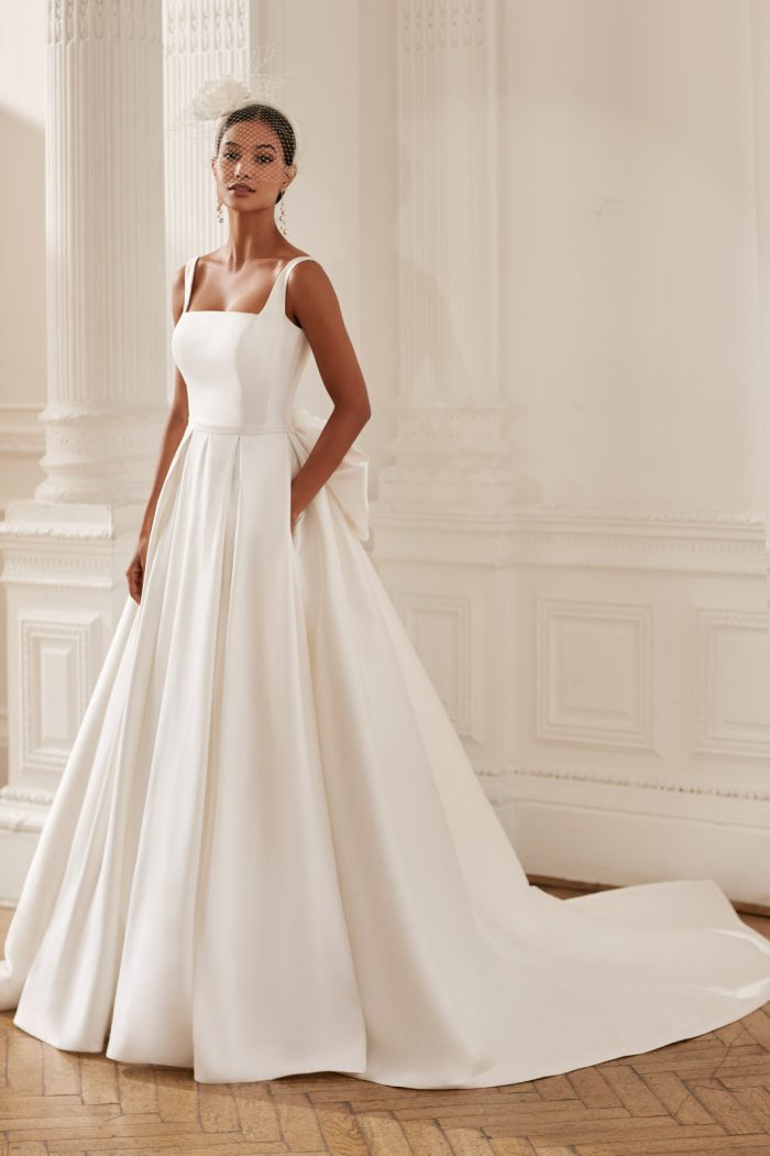 Satin ball gown with square neckline and detachable bow, by Ellis Bridal shop Northallerton