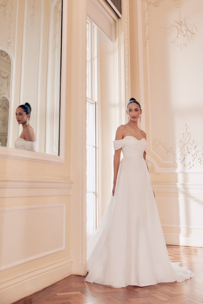 Organza off the shoulder, A-Line wedding dress with peekaboo pearl cups and beaded back, by Ellis. Bridal Shop Northallerton