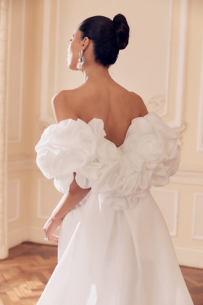 Detachable organza bridal cape with floral detail sleeves, by Ellis. 