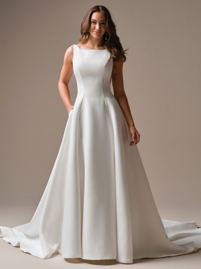 Simple bateau neck deep V-back satin A-line wedding dress, by Maggie Sottero. Bridal Shop North Yorkshire