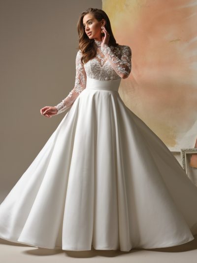 Maggie Sottero Trinity is a regal lace bodice mock neck A-line wedding dress.