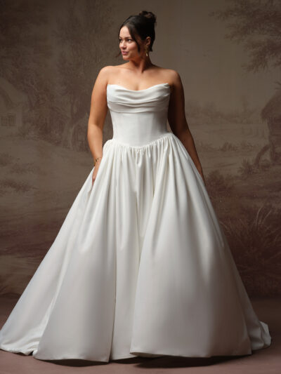 Rebecca Ingram Vanessa is a sculpted cat eye neckline basque waist satin wedding dress.  Bridal Shop North East
